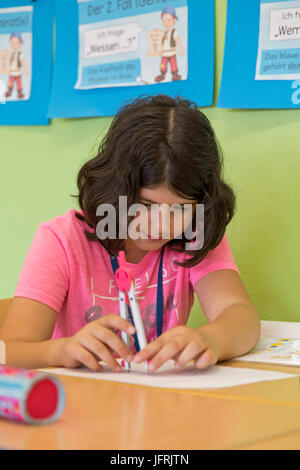 girls at primary school working with her compasses Stock Photo - Alamy