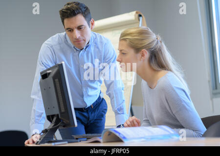male and female it programmers testing new software application Stock Photo