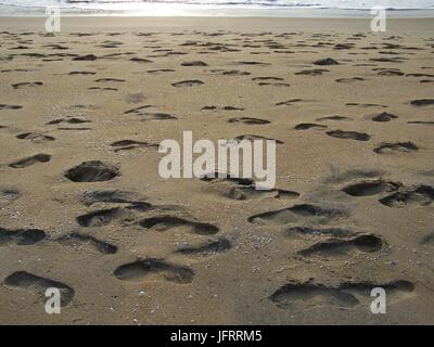 Footprints in the sand Stock Photo