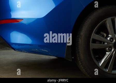 New car with damage paint on bumper. Big car paint scratch Stock Photo