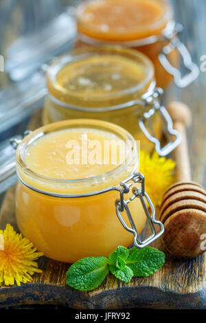 Different varieties of honey in glass jars. Stock Photo