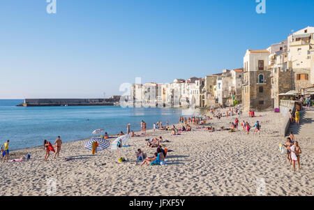 The beach and the Old Town in Cefalù, Sicily. Historic Cefalù is a major tourist destination on Sicily. Stock Photo