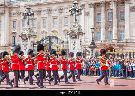 LONDON, UNITED KINGDOM – JULY 11, 2012: The band of the Grenadier Guards, led by a Drum Major of the Coldstream Guards, marches past the front of Buck Stock Photo