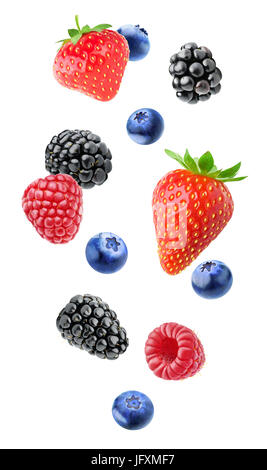 Isolated mixed berries in the air. Falling blackberry, raspberry, blueberry and strawberry fruits isolated on white background with clipping path Stock Photo