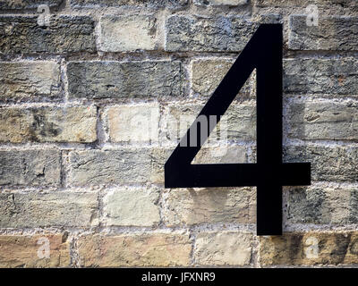Number Four 4 on a refurbished brick building Stock Photo