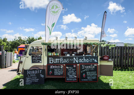 A food truck serving vegetarian Burritos and Nachos at a festival. Stock Photo