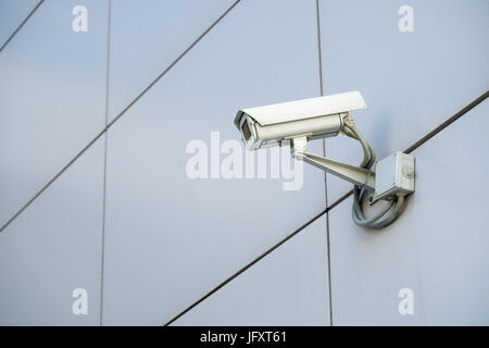 CCTV outdoor camera on a wall Stock Photo