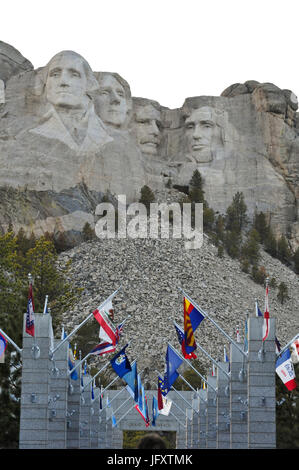 International flags line the Grand View Entrance to the Mount Rushmore National Monument where four former U.S. Presidents are carved into a granite rock face March 24, 2010 in Keystone, South Dakota.  (photo by Lance Cheung  via Planetpix) Stock Photo