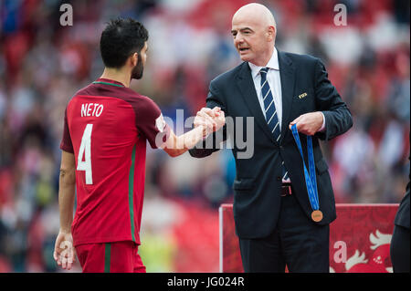 Moscow, Russia. 2nd July, 2017. President of FIFA Gianni Infantino (R) celebrates Luis Neto of Portugal with a bronze medal after the bronze match of Confederations Cup-2017 in Moscow, Russia, on July 2, 2017. Credit: Evgeny Sinitsyn/Xinhua/Alamy Live News Stock Photo