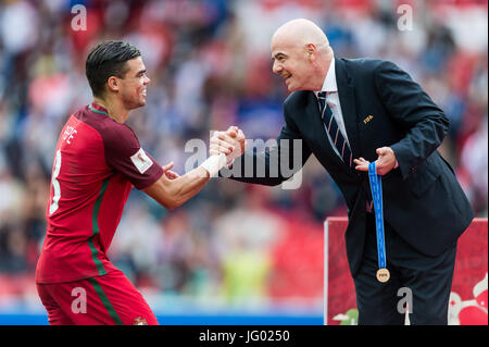 Moscow, Russia. 2nd July, 2017. President of FIFA Gianni Infantino (R) celebrates Pepe of Portugal with a bronze medal after the bronze match of Confederations Cup-2017 in Moscow, Russia, on July 2, 2017. Credit: Evgeny Sinitsyn/Xinhua/Alamy Live News Stock Photo