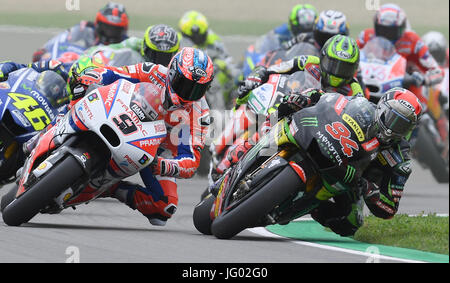 Hohenhstein-Ernstthal, Germany. 2nd July, 2017. Danilo Petrucci from Italy of the OCTO Pramac Racing Team and Jonas Folger from Germany of the Monster Yamaha Tech 3 Team (front, l-r) in action during the MotoGP race at the MotoGP Grand Prix of Germany on the Sachsenring race track in Hohenhstein-Ernstthal, Germany, 2 July 2017. Photo: Hendrik Schmidt/dpa/Alamy Live News Stock Photo