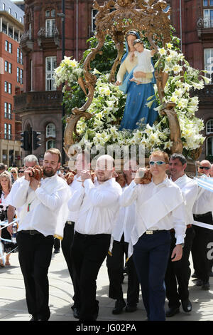 Manchester, UK. 2nd July, 2017. . Men carrying the Madonna statue in  Manchester,2nd July, 2017  Credit: Barbara Cook/Alamy Live News Stock Photo