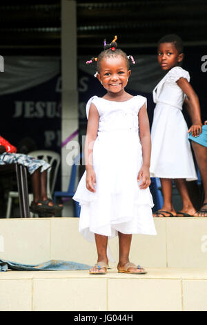 Happy Ivorian kid posing in front of a church after service Stock Photo