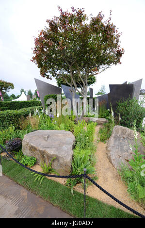 London, UK. 3rd Jul, 2017. The RHS Watch This Space Garden (designed by Andy Sturgeon), one of the beautiful and elegant show gardens on display at the 2017 RHS Hampton Court Flower Show which opened today in the grounds of Hampton Court Palace, London, UK. The RHS Hampton Court Palace Flower Show is the world's largest flower show boasting an eclectic mix of gardens, displays and shopping opportunities spanning over 34 acres either side of the dramatic long water with the stunning façade of the historical palace in the background. Credit: Michael Preston/Alamy Live News Stock Photo
