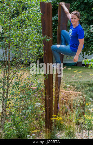London, UK. 3rd July, 2017. Thuli Lamb, free runner from Parkour Generations on the St Modwen properties plc:Brownfield - Metamorphosis garden designed by Martyn Wilson - The Hampton Court Flower Show, organised by the Royal Horticultural Society (RHS). In the grounds of the Hampton Court Palace, London. Credit: Guy Bell/Alamy Live News Stock Photo