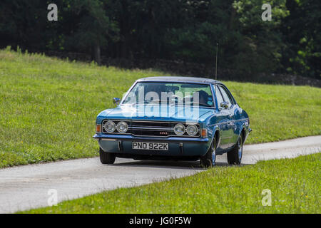 1971 70s blue Ford Cortina 2000 GXL Classic, collectable restored vintage vehicles arriving for the Mark Woodward Event at Leighton Hall, Carnforth, UK Stock Photo