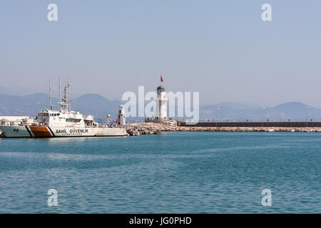 Coastguard shop moored near the lighthouse in Alanya harbour, Turkey Stock Photo