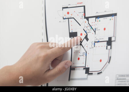 The architect studies the drawing of the new apartment Stock Photo