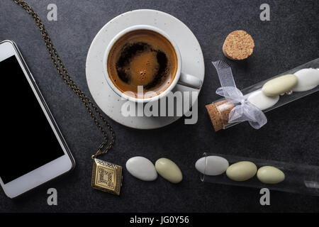 Coffee cup with phone,  from above Stock Photo