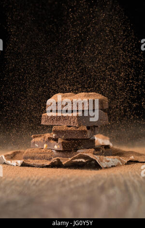 Broken chocolate on baking paper Stock Photo