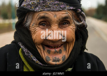 Old kurdish woman with tatoos in her face in the Martyr Sami Abdul-Rahman Park in Erbil or Hawler, capital of Iraq Kurdistan
