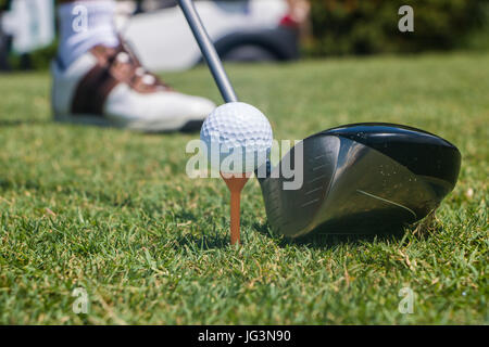 Golfer Hitting Golf Ball off Tee