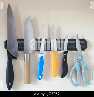 knifes and scissors on a magnet Stock Photo