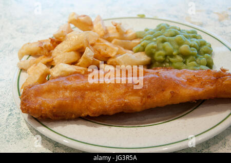 Fish,chips and mushy peas on a cafe table, Ramsey, Isle of Man. Stock Photo