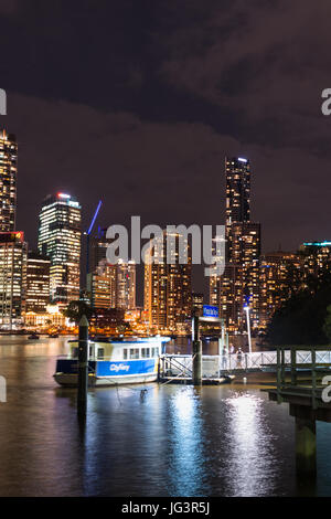 Brisbane city skyline with ferry stop after dark. Queensland. Australia. Stock Photo