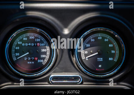 Speedometer and indicator of the engine speed on dashboard of a Harley Davidson motorcycle. Stock Photo