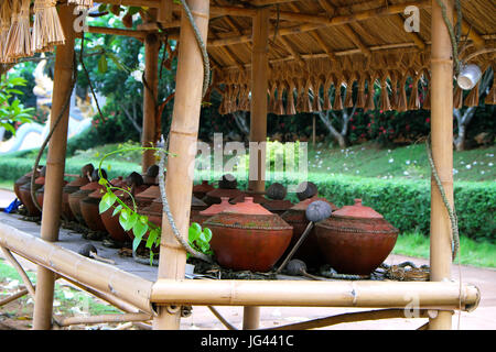 Drinking water pottery in bamboo booth for traveler. Traditional life in Chiangmai, Thailand. Stock Photo