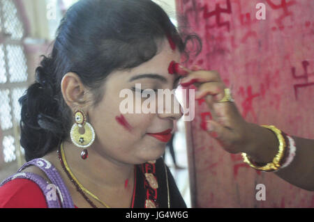 Abhisek Saha / Le Pictorium -  Kharchi Puja festival in India -  22/06/2017  -  India / Tripura / Agartala  -  Women are drawing swastik (Holy Sign) in the temple  and giving vermilion with wish of a happy married life  on the occeasion of Ambubachi , in a temple of Agartala, capital of the northeastern state of Tripura.                                                              Ambubachi is the celebration of the menstruation  of mother earth.The belive is, During Ambubachi , for three days mother earth herself menstruates.Pix By-Abhisek Saha Stock Photo