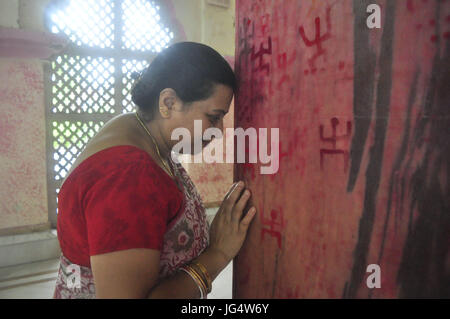 Abhisek Saha / Le Pictorium -  Kharchi Puja festival in India -  22/06/2017  -  India / Tripura / Agartala  -  Women are drawing swastik (Holy Sign) in the temple  and giving vermilion with wish of a happy married life  on the occeasion of Ambubachi , in a temple of Agartala, capital of the northeastern state of Tripura.                                                              Ambubachi is the celebration of the menstruation  of mother earth.The belive is, During Ambubachi , for three days mother earth herself menstruates.Pix By-Abhisek Saha Stock Photo