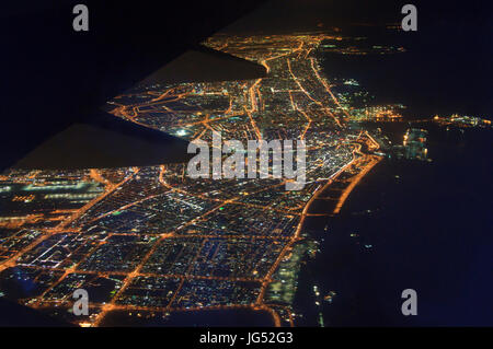 Aerial view from jat plane to the Dubai city at night Stock Photo