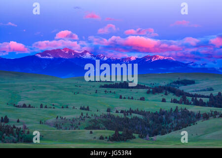 sunrise on peaks of the flint creek range above spotted dog creek basin near avon, montana Stock Photo