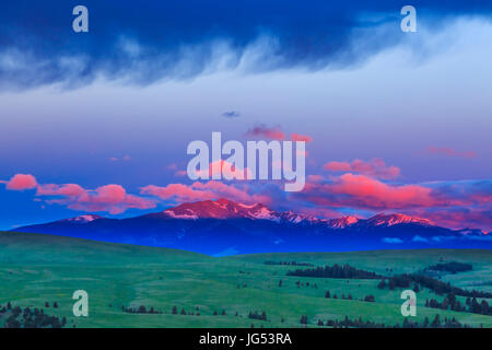 sunrise on peaks of the flint creek range above spotted dog creek basin near avon, montana Stock Photo