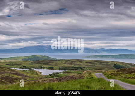 Hazy Arran under clouds in Summer with good detail on Arran taken from Fairlie Moor near Largs Ayrshire Scotland. Stock Photo