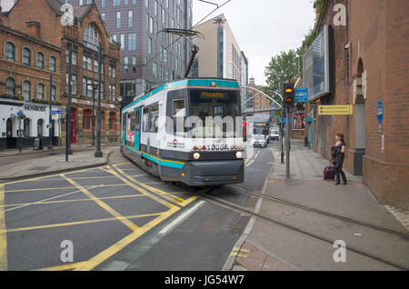 Manchester Metrolink T-68A tram 1006 crossing London Road to enter Piccadilly station. Manchester, UK Stock Photo