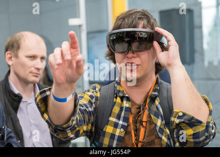 Young man testing hololens VR glasses at VR conference Stock Photo