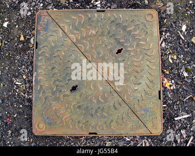 cast iron vintage drain cover colorful grunge makers name Stock Photo