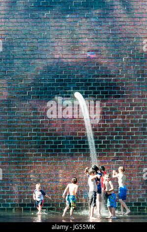 Children playing in Crown Fountain In Millennium Park, Chicago. Stock Photo