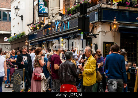 People Drinking Outside The White Horse Pub, Newburgh Street, Off Carnaby Street, London, UK Stock Photo