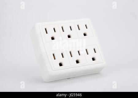 White multiple electric socket adapter isolated on white background. Stock Photo
