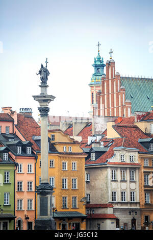 Zygmunt Column monument and charming tenements in the city center of Warsaw, Poland Stock Photo