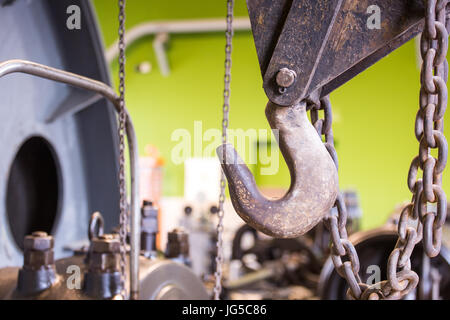 Vintage mining winch empowered by steam engine. Hook. Stock Photo