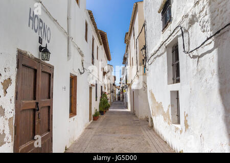 Narrow street with white houses in Requena, Spain Stock Photo