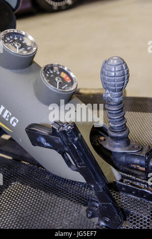 Custom tricycle motorcycle with a grenade attached to the gear selector, and a pistol grip on the hand brake. Stock Photo