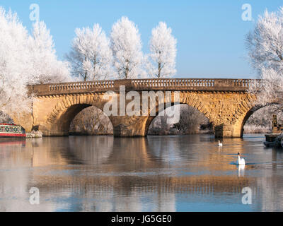 Bridge in a frozen landscape, Oxfordshire, England, Stock Photo