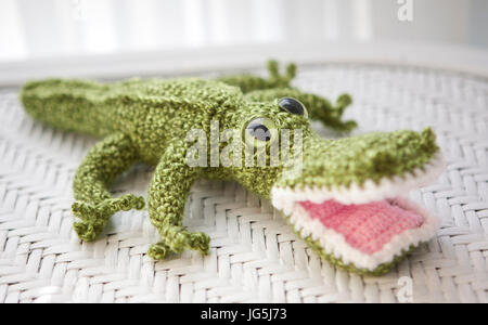 Handmade green crocheted crocodile Stock Photo