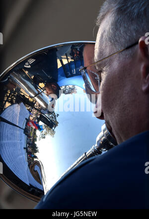 Air National Guard Master Sgt. Jeffrey Gould, a musician with the Air National Guard Band of the West Coast, plays the euphonium during the City of Manhattan Beach “Salute to the Troops” concert at Polliwog Park, Manhattan Beach, Calif., July 2, 2017.  The “Salute to the Troops” concert featured the Air National Guard Band of the West Coast, with guest tenor, Dennis McNeil, and included a special presentation of a certificate to Los Angeles Air Force Base, accepted by 61st Air Base Group commander, Col. Charles P. Roberts. (U.S. Air Force photo by Sarah Corrice.) Stock Photo